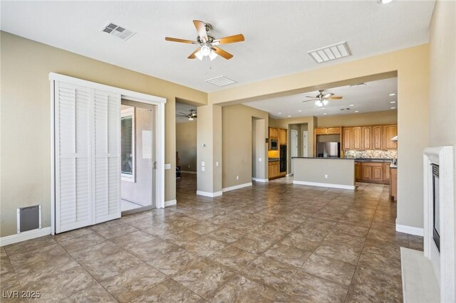 3904 Redbreast Ln, North Las Vegas, NV 89084 - unfurnished living room with ceiling fan and visible vents