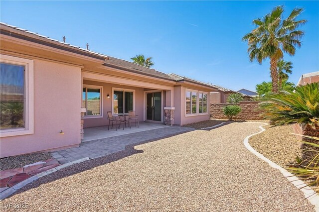 3904 Redbreast Ln, North Las Vegas, NV 89084 - back of property with a patio area and stucco siding