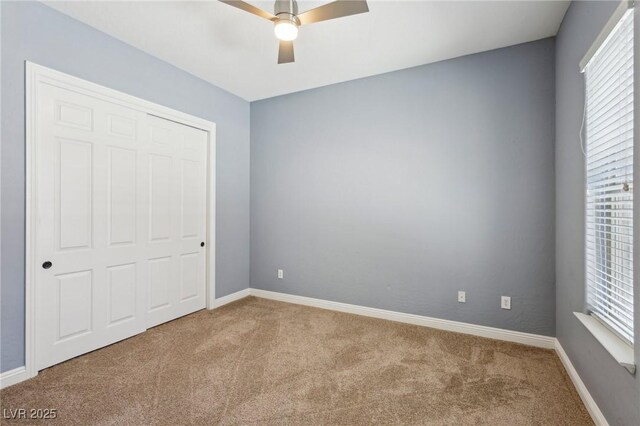 3904 Redbreast Ln, North Las Vegas, NV 89084 - unfurnished bedroom featuring baseboards, a ceiling fan, and carpet