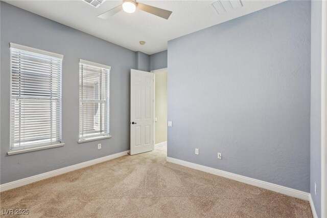 3904 Redbreast Ln, North Las Vegas, NV 89084 - unfurnished bedroom featuring light carpet, baseboards, visible vents, and multiple windows
