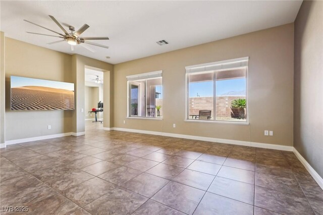 3904 Redbreast Ln, North Las Vegas, NV 89084 - tiled spare room featuring baseboards, a ceiling fan, and visible vents