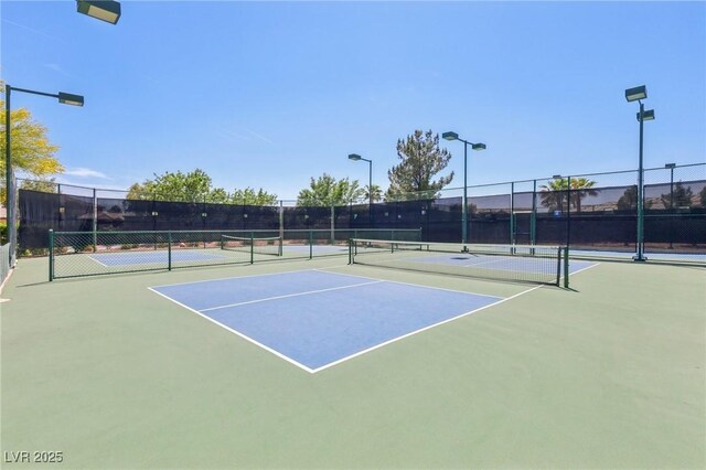 3904 Redbreast Ln, North Las Vegas, NV 89084 - view of tennis court with community basketball court and fence