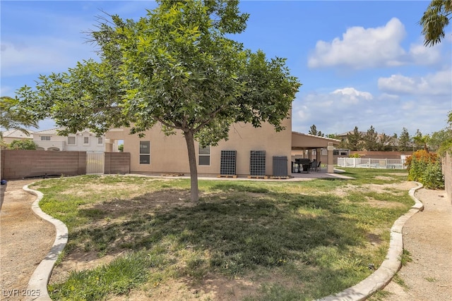 view of yard with a fenced backyard and a patio