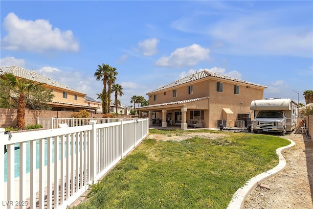 view of yard featuring a fenced in pool, a patio area, and fence