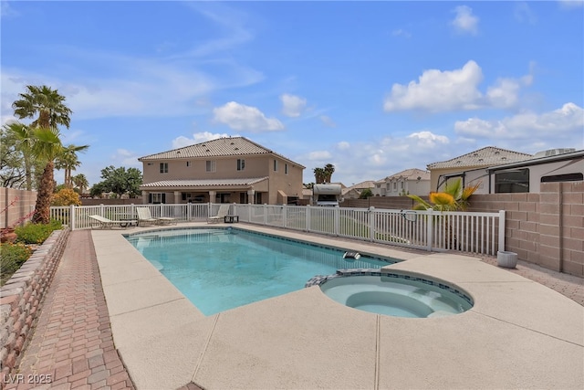 view of pool with a pool with connected hot tub and fence private yard