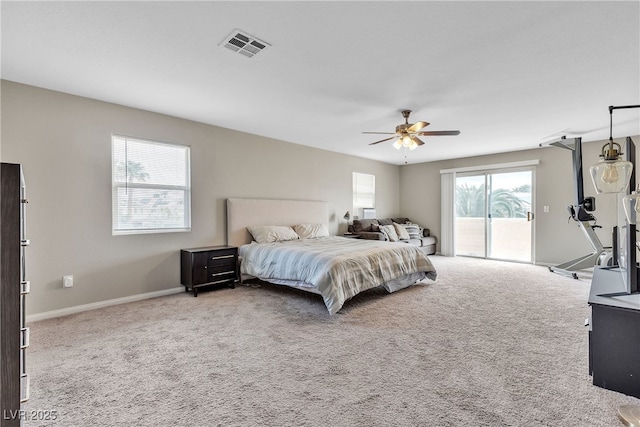 bedroom with multiple windows, visible vents, carpet, and access to exterior