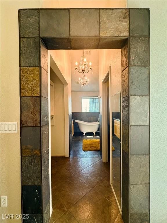 1105 Enderly Ln, Las Vegas, NV 89144 - corridor featuring a chandelier
