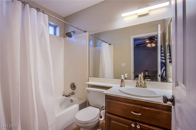 bathroom featuring vanity, a ceiling fan, shower / bath combination with curtain, and toilet