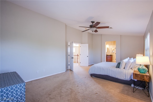 carpeted bedroom featuring ceiling fan, visible vents, baseboards, connected bathroom, and lofted ceiling