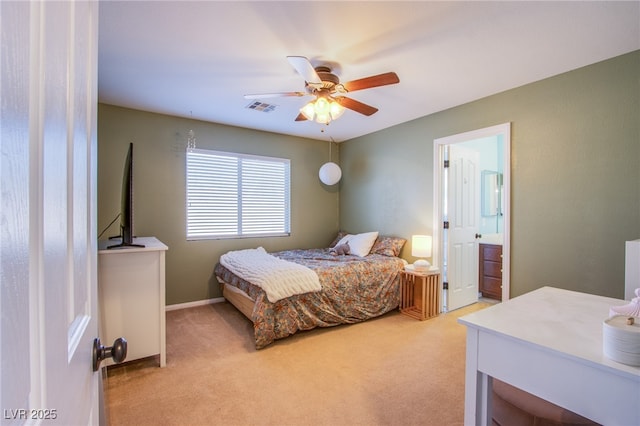 bedroom with visible vents, light carpet, baseboards, ensuite bathroom, and ceiling fan