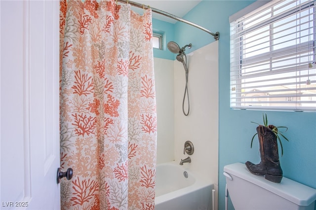 full bath featuring shower / bath combo with shower curtain, a healthy amount of sunlight, and toilet