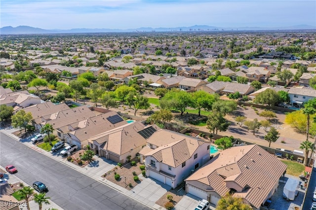 drone / aerial view featuring a residential view and a mountain view