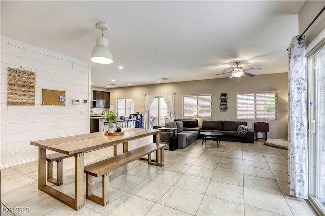 dining room with recessed lighting, a ceiling fan, light tile patterned flooring, and a healthy amount of sunlight