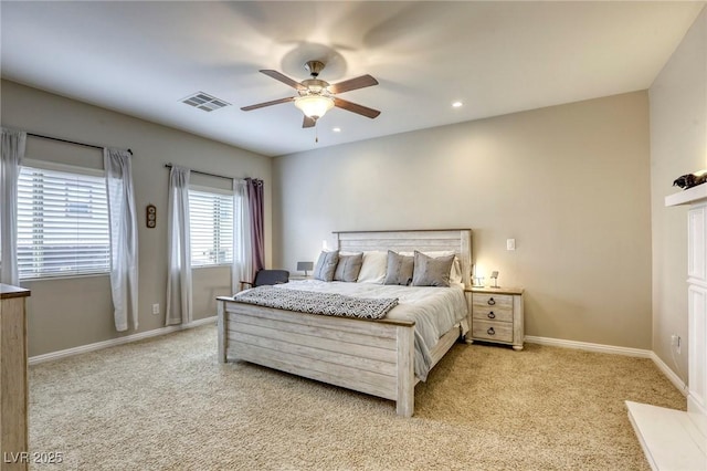 bedroom with recessed lighting, baseboards, light colored carpet, and visible vents