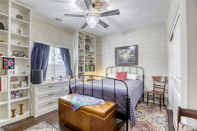 bedroom featuring a ceiling fan, dark wood-style floors, and visible vents