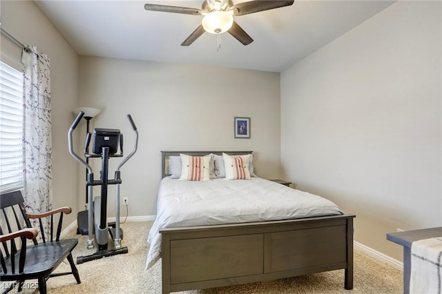bedroom with a ceiling fan and baseboards