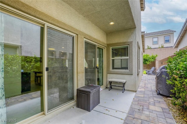 view of patio featuring fence