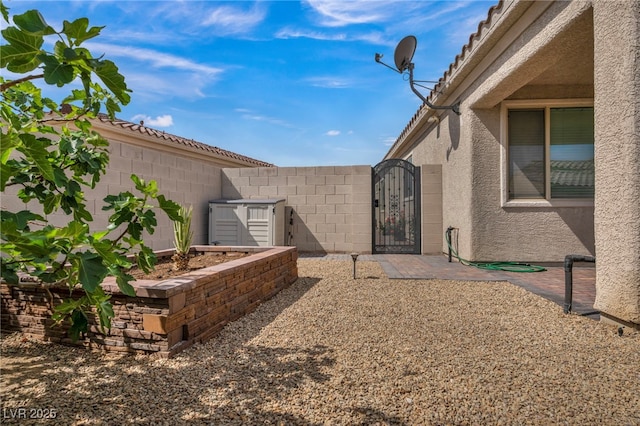 view of yard with a gate and fence