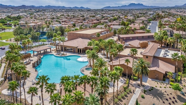 birds eye view of property with a residential view and a mountain view