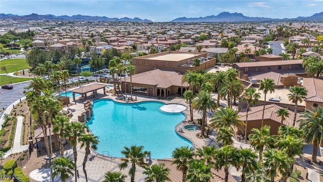 pool featuring a residential view and a mountain view