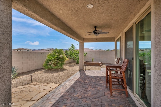 view of patio / terrace featuring a fenced backyard and ceiling fan