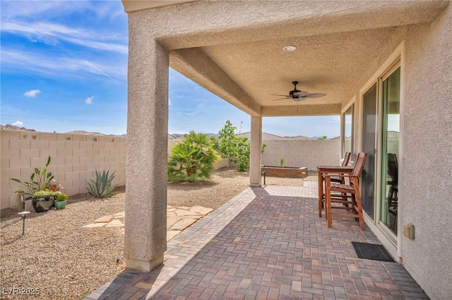 view of patio / terrace with a fenced backyard and ceiling fan