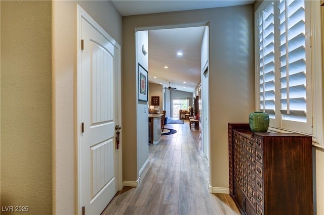 8036 Literature Ct, Las Vegas, NV 89113 - hallway with baseboards, wood finished floors, and recessed lighting