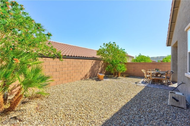 8036 Literature Ct, Las Vegas, NV 89113 - view of yard featuring a fenced backyard and a patio