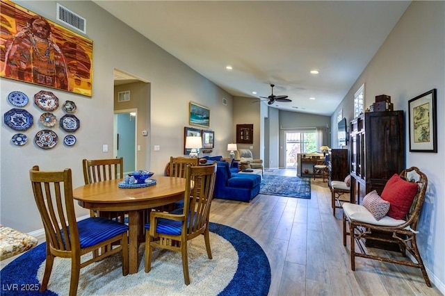 8036 Literature Ct, Las Vegas, NV 89113 - dining room featuring vaulted ceiling, visible vents, light wood finished floors, and ceiling fan