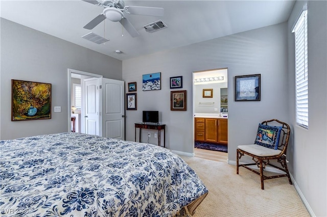 8036 Literature Ct, Las Vegas, NV 89113 - bedroom with visible vents, baseboards, light carpet, and connected bathroom
