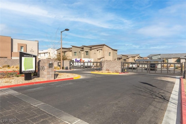 600 N Carriage Hill Dr Unit 2098, Las Vegas, NV 89138 - view of road with a gated entry, street lighting, a residential view, and a gate