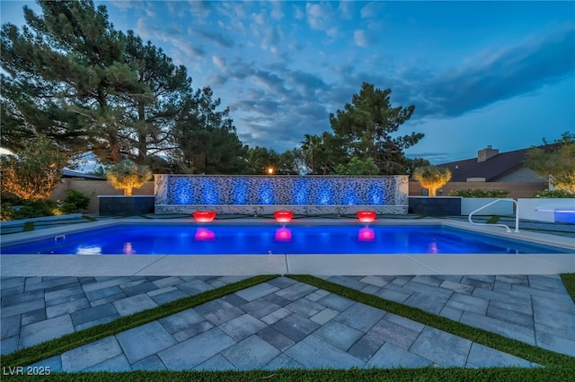 view of swimming pool featuring a fenced backyard, a patio, and a fenced in pool