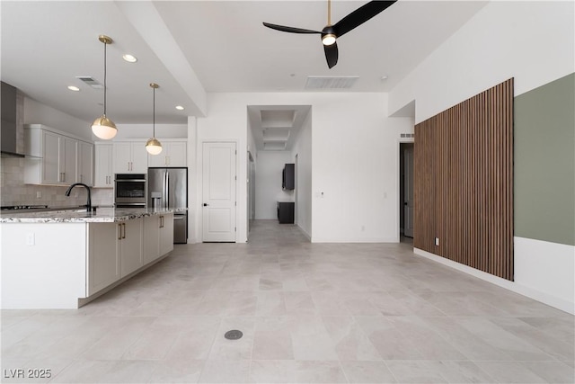 kitchen featuring recessed lighting, ceiling fan, tasteful backsplash, visible vents, and stainless steel fridge with ice dispenser