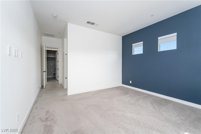 91 Alta Cascata Pl, Henderson, NV 89011 - unfurnished bedroom with baseboards, light carpet, and visible vents