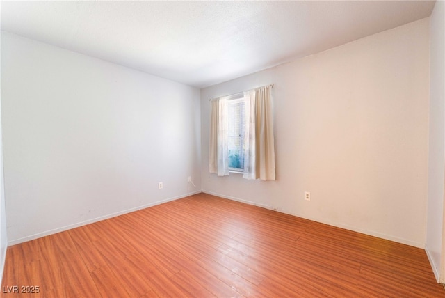 4687 Monterey Cir Unit 1, Las Vegas, NV 89169 - empty room featuring baseboards and light wood-type flooring