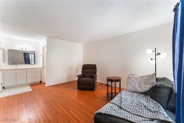 4687 Monterey Cir Unit 1, Las Vegas, NV 89169 - interior space featuring baseboards, wood finished floors, and a textured ceiling