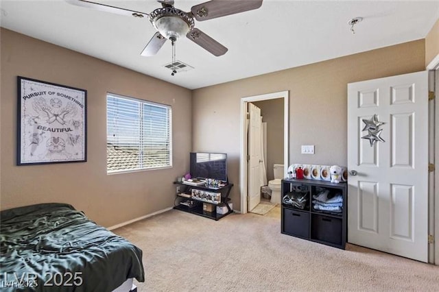 bedroom featuring carpet flooring, ensuite bathroom, baseboards, visible vents, and ceiling fan