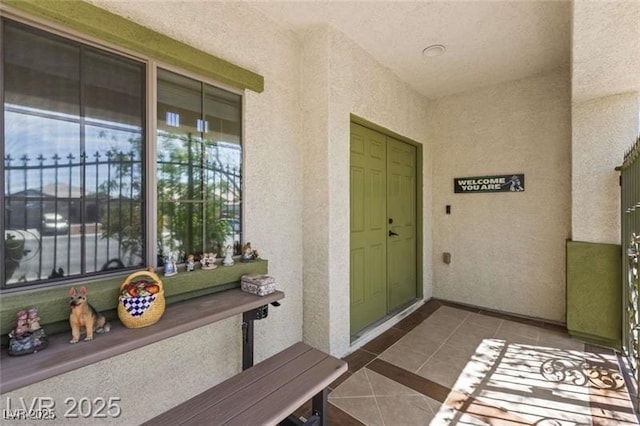 property entrance featuring stucco siding