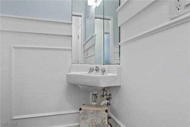 4298 Cartegena Way, Las Vegas, NV 89121 - bathroom with baseboards and a sink