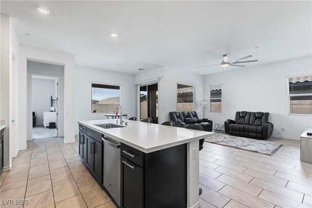 713 Webber Park St, Henderson, NV 89011 - kitchen with recessed lighting, light countertops, a ceiling fan, dark cabinetry, and a sink