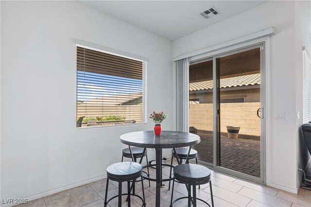 713 Webber Park St, Henderson, NV 89011 - dining area with baseboards, visible vents, and light tile patterned floors