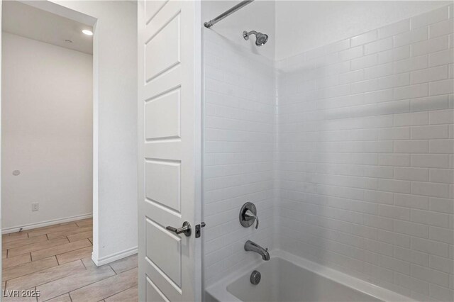 713 Webber Park St, Henderson, NV 89011 - bathroom featuring wood tiled floor, baseboards, and shower / bath combination