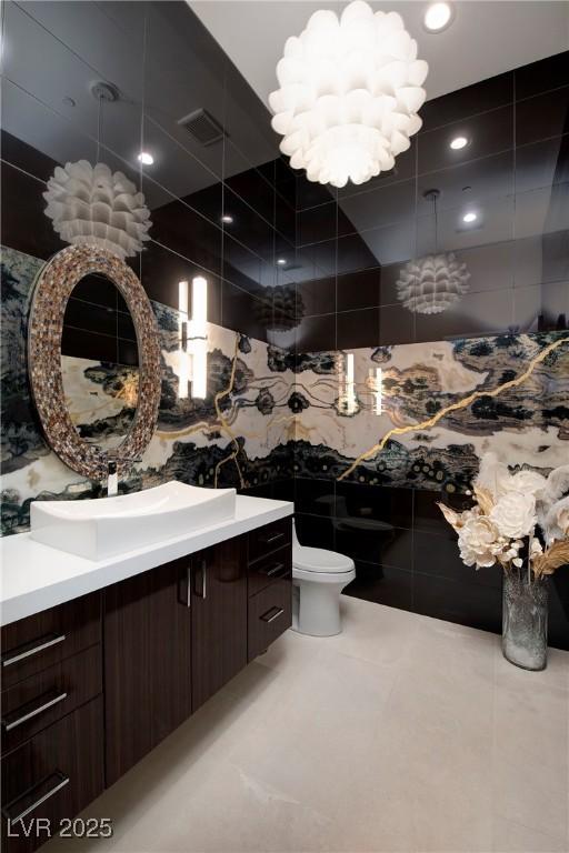 661 Dragon Peak Dr, Henderson, NV 89012 - bathroom featuring vanity, toilet, visible vents, and tile patterned floors