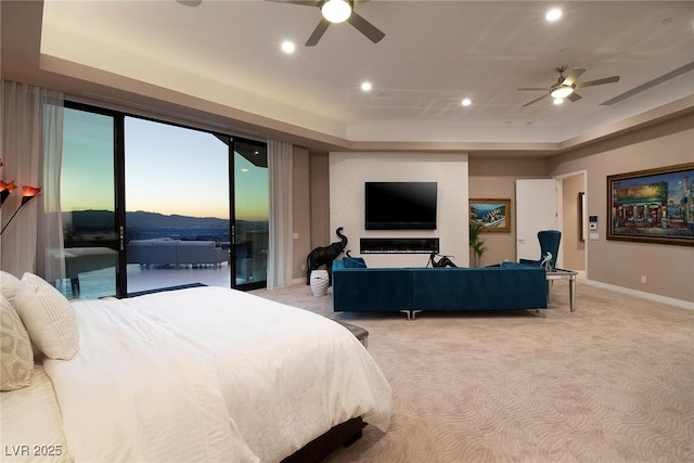 661 Dragon Peak Dr, Henderson, NV 89012 - bedroom with light carpet, a raised ceiling, access to outside, and recessed lighting