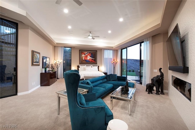 661 Dragon Peak Dr, Henderson, NV 89012 - living room featuring a raised ceiling, ceiling fan, and carpet floors