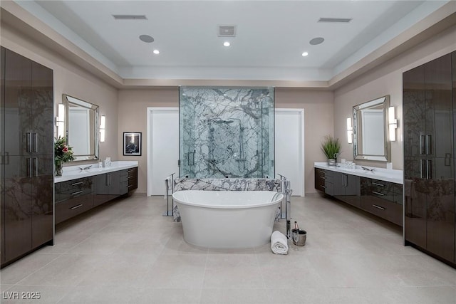 661 Dragon Peak Dr, Henderson, NV 89012 - bathroom with a tray ceiling, a shower stall, and plenty of natural light