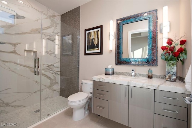 661 Dragon Peak Dr, Henderson, NV 89012 - full bathroom featuring vanity, toilet, a marble finish shower, and tile patterned flooring