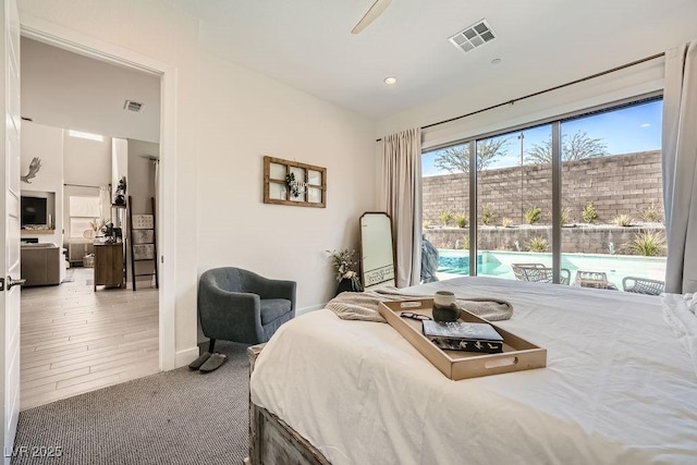 bedroom featuring access to outside, baseboards, visible vents, and carpet