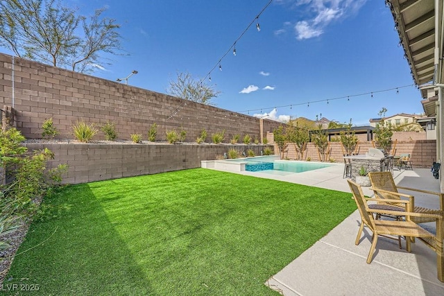 view of yard with a fenced in pool, a fenced backyard, and a patio area