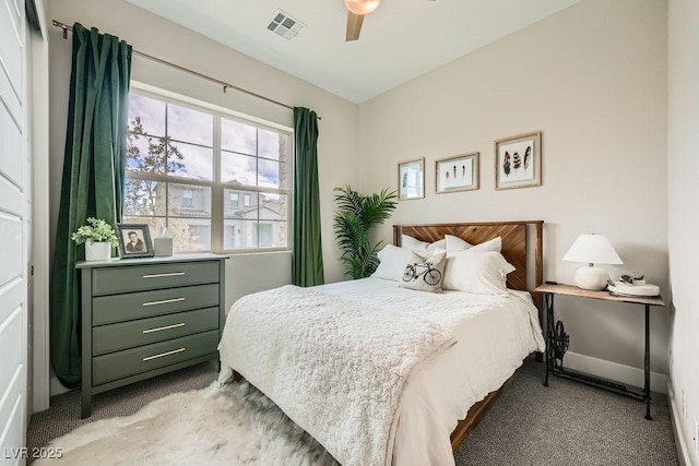 bedroom featuring light colored carpet, ceiling fan, visible vents, and baseboards